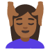 woman getting massage: medium-dark skin tone on Google
