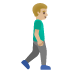 man walking facing right: medium-light skin tone on Google