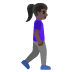 woman walking facing right: dark skin tone on Google