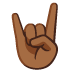 sign of the horns: medium-dark skin tone on Google
